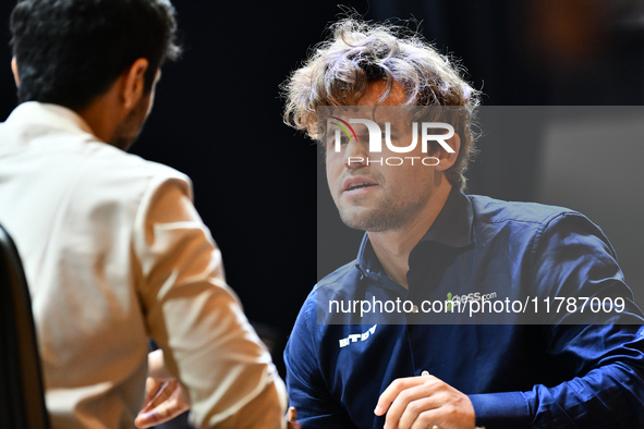 Norwegian GM Magnus Carlsen plays chess during the 6th TATA Steel Chess India Tournament at Dhono Dhanyo Auditorium in Kolkata, India, on No...