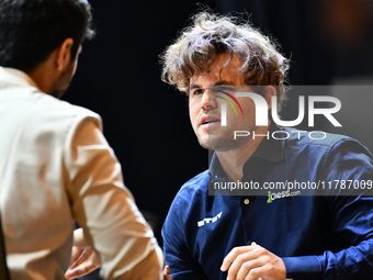 Norwegian GM Magnus Carlsen plays chess during the 6th TATA Steel Chess India Tournament at Dhono Dhanyo Auditorium in Kolkata, India, on No...