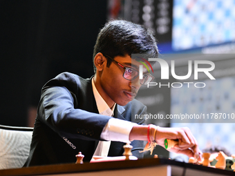 Indian GM Rameshbabu Praggnanandhaa plays chess during the 6th TATA Steel Chess India Tournament at Dhono Dhanyo Auditorium in Kolkata, Indi...