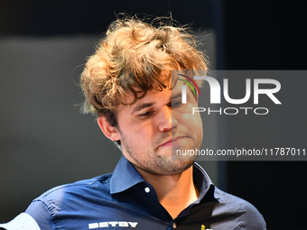 Norwegian GM Magnus Carlsen plays chess during the 6th TATA Steel Chess India Tournament at Dhono Dhanyo Auditorium in Kolkata, India, on No...