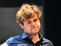 Norwegian GM Magnus Carlsen plays chess during the 6th TATA Steel Chess India Tournament at Dhono Dhanyo Auditorium in Kolkata, India, on No...