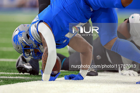 DETROIT,MICHIGAN-NOVEMBER17:  Running back David Montgomery (5) of the Detroit Lions is taken down while carrying the ball during a game bet...