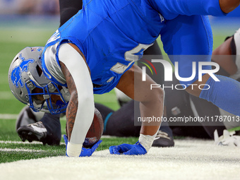 DETROIT,MICHIGAN-NOVEMBER17:  Running back David Montgomery (5) of the Detroit Lions is taken down while carrying the ball during a game bet...