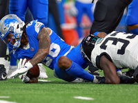 DETROIT,MICHIGAN-NOVEMBER17:  Running back Jahmyr Gibbs (26) of the Detroit Lions is tackled by linebacker Devin Lloyd (33) of the Jacksonvi...