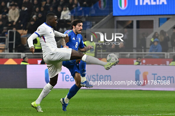 Sandro Tonali (ITA) and Christopher Nkunku (FRA) are in action during the UEFA Nations League Matchday 6 match between Italy and France at t...