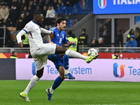 Sandro Tonali (ITA) and Christopher Nkunku (FRA) are in action during the UEFA Nations League Matchday 6 match between Italy and France at t...