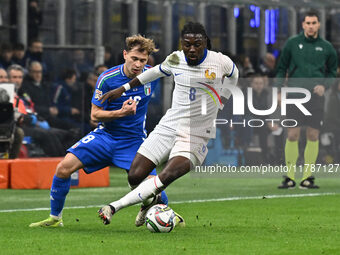 Nicolo Barella (ITA) and Manu Kone (FRA) are in action during the UEFA Nations League Matchday 6 match between Italy and France at the San S...