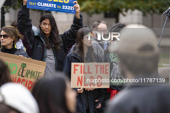 Environmental activists rally to demand climate action before US President-elect Donald Trump takes office in Washington, DC, on November 17...