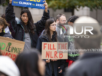 Environmental activists rally to demand climate action before US President-elect Donald Trump takes office in Washington, DC, on November 17...