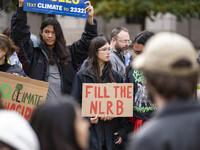 Environmental activists rally to demand climate action before US President-elect Donald Trump takes office in Washington, DC, on November 17...