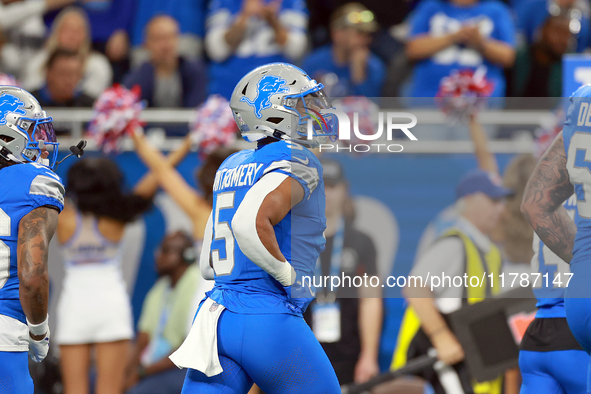 DETROIT,MICHIGAN-NOVEMBER17: Running back David Montgomery (5) of the Detroit Lions runs off the field after making the first touchdown of...