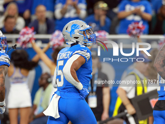 DETROIT,MICHIGAN-NOVEMBER17: Running back David Montgomery (5) of the Detroit Lions runs off the field after making the first touchdown of...