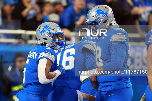 DETROIT,MICHIGAN-NOVEMBER17:  Running back David Montgomery (5) of the Detroit Lions celebrates his touchdown during a game between the Detr...