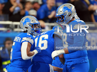 DETROIT,MICHIGAN-NOVEMBER17:  Running back David Montgomery (5) of the Detroit Lions celebrates his touchdown during a game between the Detr...