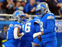 DETROIT,MICHIGAN-NOVEMBER17:  Running back David Montgomery (5) of the Detroit Lions celebrates his touchdown during a game between the Detr...