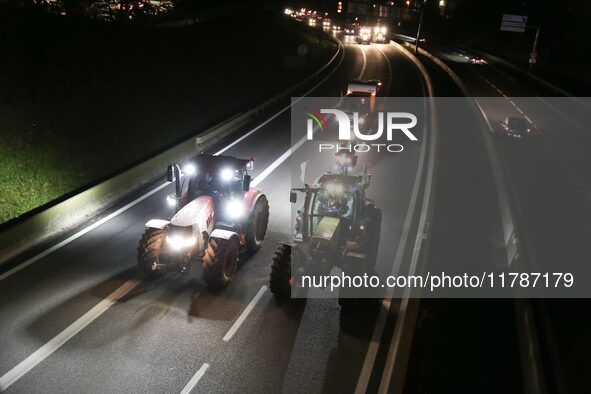 French farmers drive their tractors on the RN118 road at the start of a nationwide protest against the EU-Mercosur agreement, with farmers f...