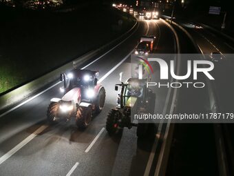 French farmers drive their tractors on the RN118 road at the start of a nationwide protest against the EU-Mercosur agreement, with farmers f...