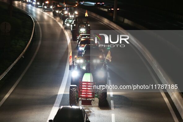 French farmers drive their tractors on the RN118 road at the start of a nationwide protest against the EU-Mercosur agreement, with farmers f...