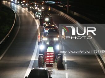 French farmers drive their tractors on the RN118 road at the start of a nationwide protest against the EU-Mercosur agreement, with farmers f...