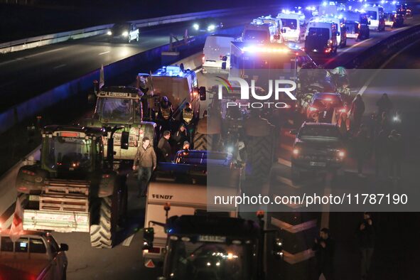 French farmers drive their tractors on the RN118 road at the start of a nationwide protest against the EU-Mercosur agreement, with farmers f...