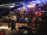 French farmers drive their tractors on the RN118 road at the start of a nationwide protest against the EU-Mercosur agreement, with farmers f...