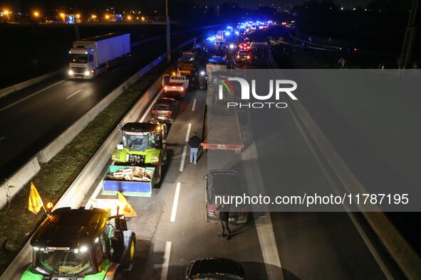 French farmers drive their tractors on the RN118 road at the start of a nationwide protest against the EU-Mercosur agreement, with farmers f...