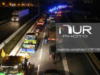 French farmers drive their tractors on the RN118 road at the start of a nationwide protest against the EU-Mercosur agreement, with farmers f...