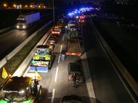 French farmers drive their tractors on the RN118 road at the start of a nationwide protest against the EU-Mercosur agreement, with farmers f...