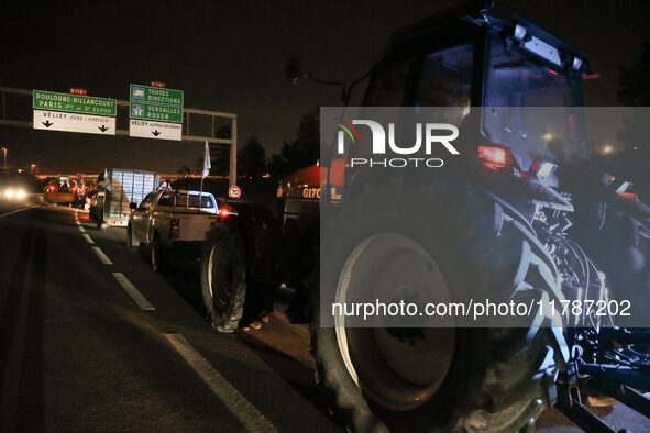 French farmers drive their tractors on the RN118 road at the start of a nationwide protest against the EU-Mercosur agreement, with farmers f...