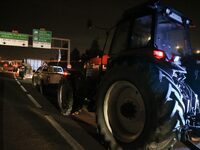 French farmers drive their tractors on the RN118 road at the start of a nationwide protest against the EU-Mercosur agreement, with farmers f...