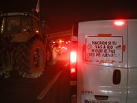 A French farmer drives his car with a banner reading ''Macron if you're going to Rio don't forget your rednecks'' on the RN118 road at the s...