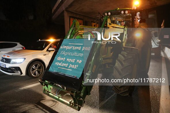 French farmers drive their tractors on the RN118 road at the start of a nationwide protest against the EU-Mercosur agreement, with farmers f...