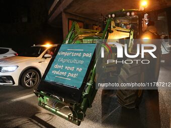 French farmers drive their tractors on the RN118 road at the start of a nationwide protest against the EU-Mercosur agreement, with farmers f...