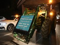 French farmers drive their tractors on the RN118 road at the start of a nationwide protest against the EU-Mercosur agreement, with farmers f...