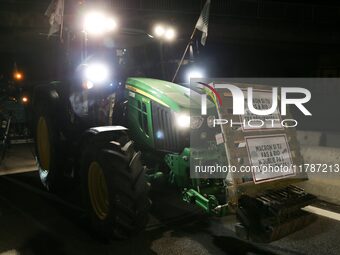 French farmers drive their tractors on the RN118 road at the start of a nationwide protest against the EU-Mercosur agreement, with farmers f...