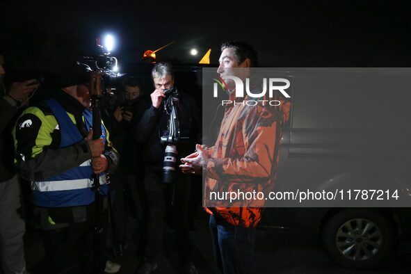 A farmer speaks with the press on the RN118 road at the start of a nationwide protest against the EU-Mercosur agreement, with farmers feelin...