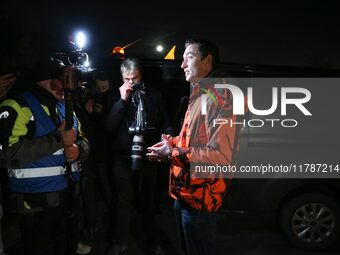 A farmer speaks with the press on the RN118 road at the start of a nationwide protest against the EU-Mercosur agreement, with farmers feelin...