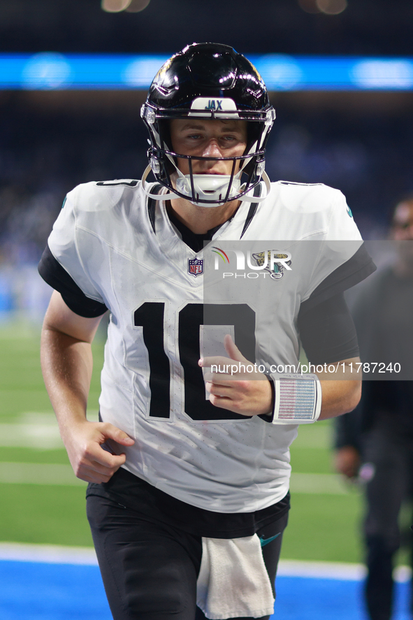 DETROIT,MICHIGAN-November 17: Jacksonville Jaguars quarterback Mac Jones (10) walks off the field after an NFL football game between the Jac...