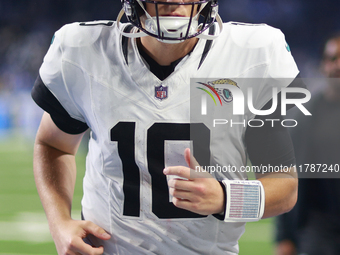 DETROIT,MICHIGAN-November 17: Jacksonville Jaguars quarterback Mac Jones (10) walks off the field after an NFL football game between the Jac...