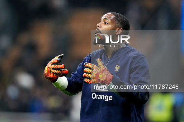 Mike Maignan of France gestures during the UEFA Nations League 2024/25 League A Group 2 match between Italy and France at Stadio Giuseppe Me...