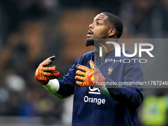 Mike Maignan of France gestures during the UEFA Nations League 2024/25 League A Group 2 match between Italy and France at Stadio Giuseppe Me...