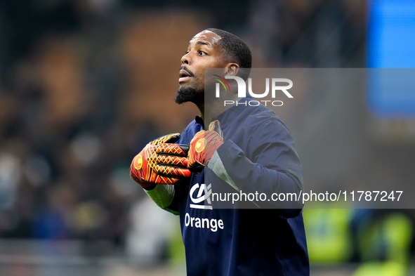 Mike Maignan of France gestures during the UEFA Nations League 2024/25 League A Group 2 match between Italy and France at Stadio Giuseppe Me...