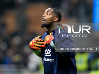 Mike Maignan of France gestures during the UEFA Nations League 2024/25 League A Group 2 match between Italy and France at Stadio Giuseppe Me...