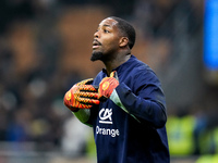 Mike Maignan of France gestures during the UEFA Nations League 2024/25 League A Group 2 match between Italy and France at Stadio Giuseppe Me...