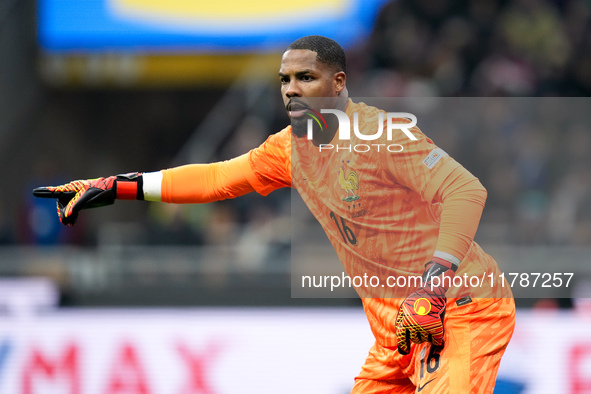 Mike Maignan of France gestures during the UEFA Nations League 2024/25 League A Group 2 match between Italy and France at Stadio Giuseppe Me...