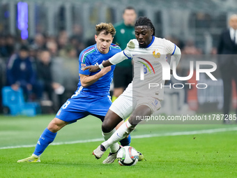 Nicolo' Barella of Italy and Manu Kone' of France compete for the ball 1during the UEFA Nations League 2024/25 League A Group 2 match betwee...