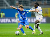 Manu Kone' of France and Nicolo' Barella of Italy compete for the ball during the UEFA Nations League 2024/25 League A Group 2 match between...