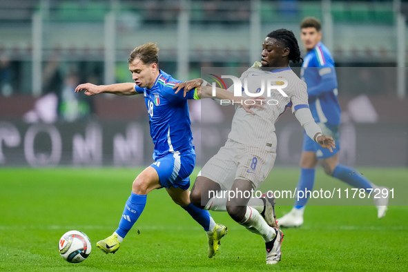 Manu Kone' of France and Nicolo' Barella of Italy compete for the ball during the UEFA Nations League 2024/25 League A Group 2 match between...