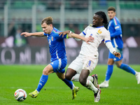 Manu Kone' of France and Nicolo' Barella of Italy compete for the ball during the UEFA Nations League 2024/25 League A Group 2 match between...