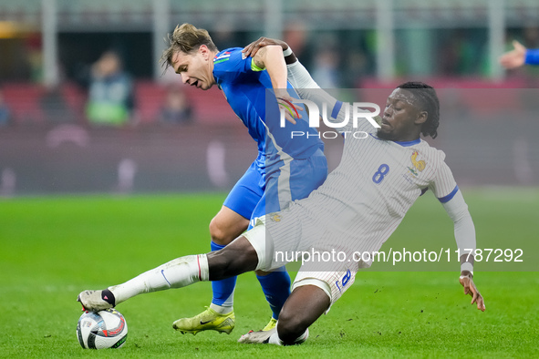 Manu Kone' of France and Nicolo' Barella of Italy compete for the ball during the UEFA Nations League 2024/25 League A Group 2 match between...